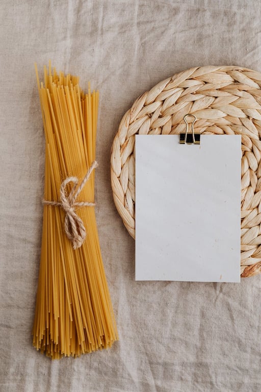 Composition avec un presse-papiers vide et des spaghettis sur une table de cuisine